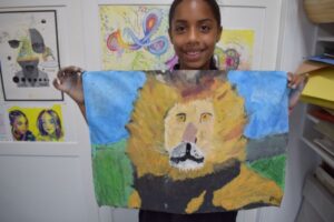 Student with lion painting