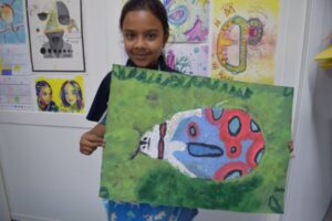 Student with beetle painting