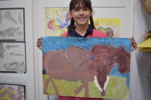 Student with elephant painting